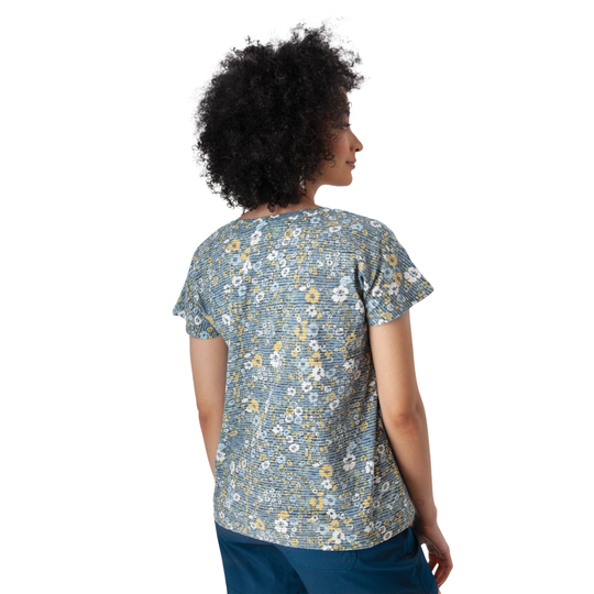 Woman wearing a floral patterned shirt on a white background