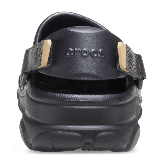 Black Crocs sandal with strap on a white background
