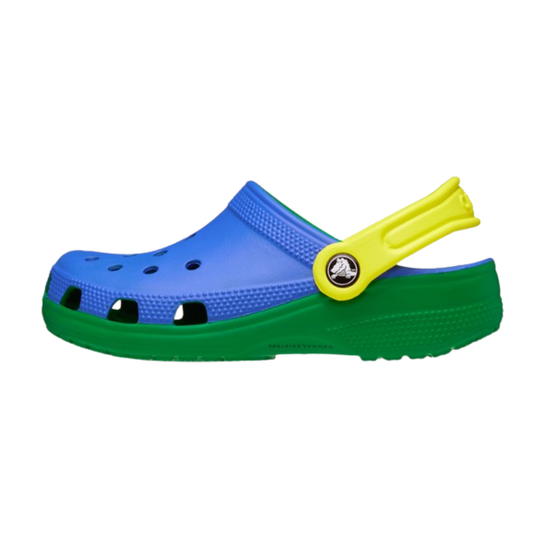 Blue and green clog shoe with yellow strap on a white background