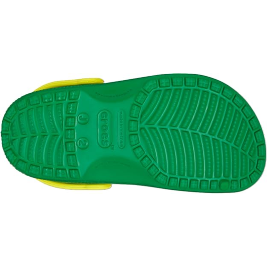 Green and yellow sandal sole with Crocs branding on a white background