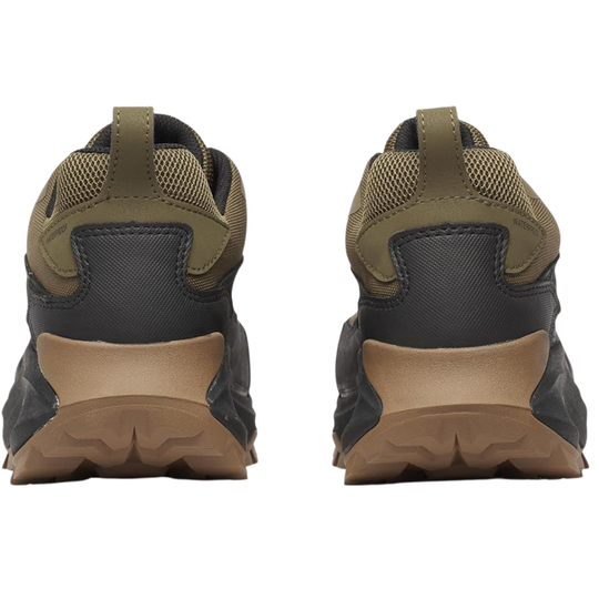Pair of brown and black hiking shoes on a white background
