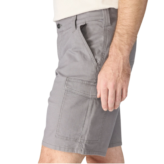 A close-up of a person wearing gray cargo shorts with a light-colored shirt, showing the side and front pocket details against a plain white background.