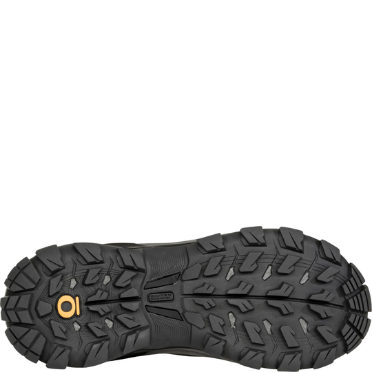 Close-up of a black hiking shoe sole with a white background