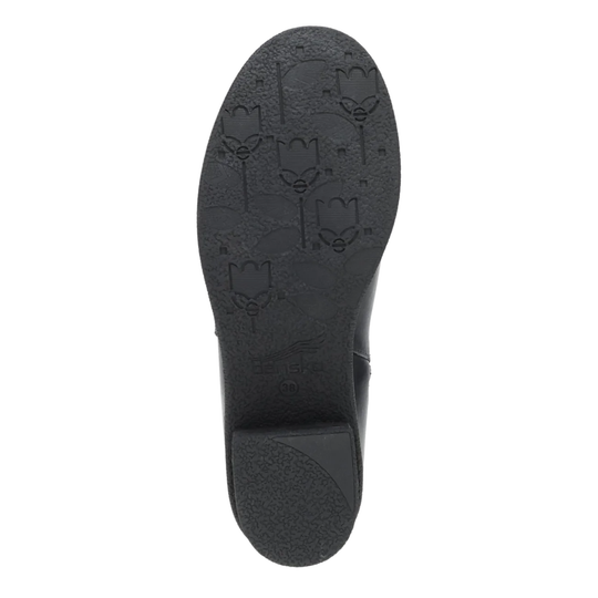 Top-down view of a black shoe sole with embossed floral patterns, shown on a plain white background.