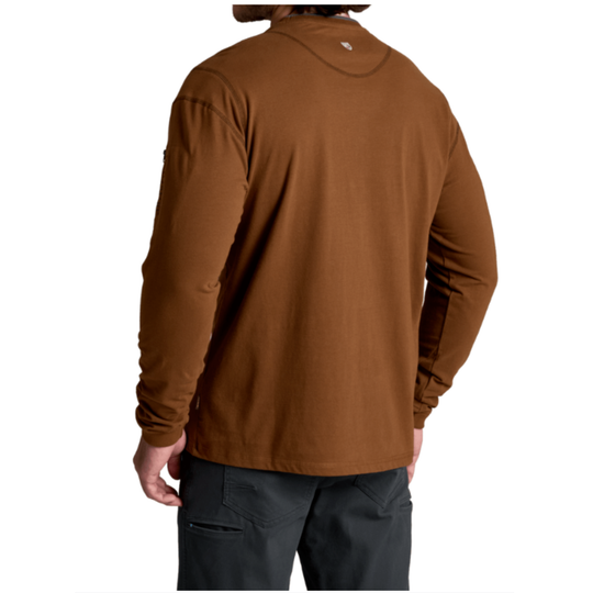 A man wearing a brown long-sleeve performance shirt, shown from the back against a white background.