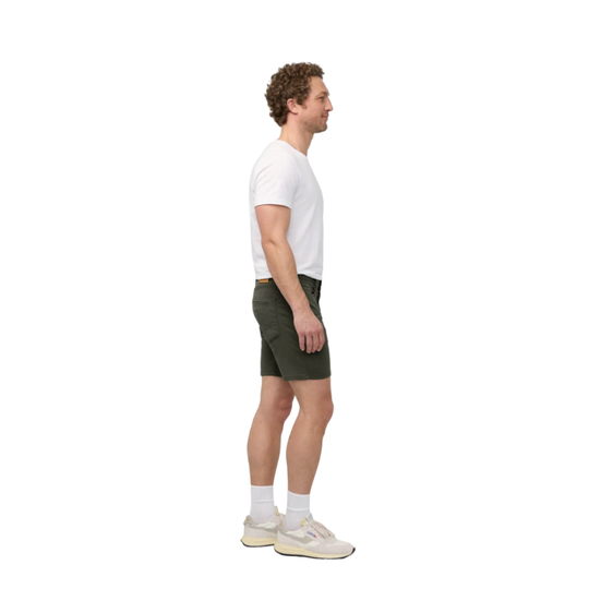 Man wearing a white t-shirt and green shorts on a white background