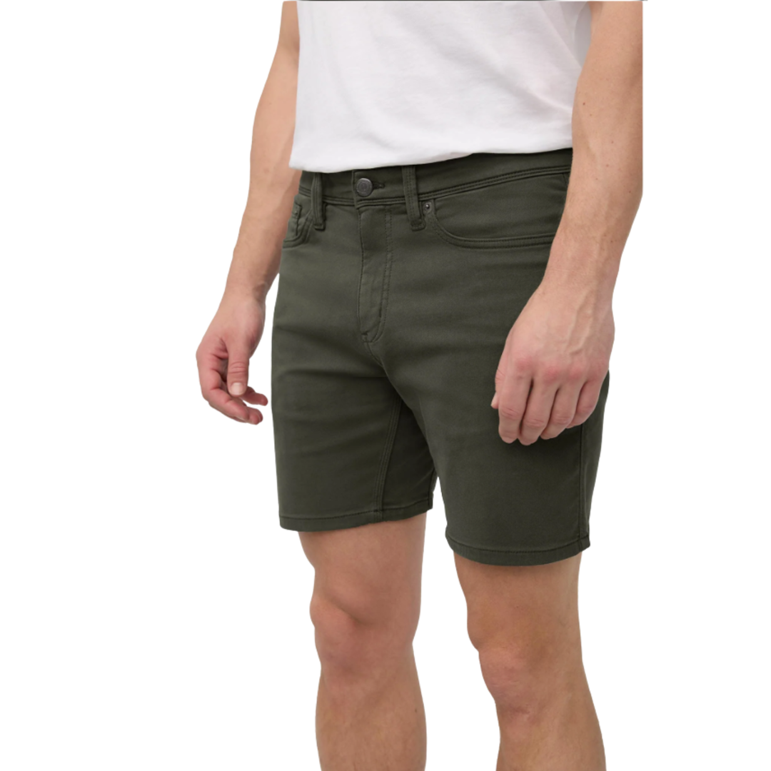 Man wearing a white t-shirt and green shorts on a white background