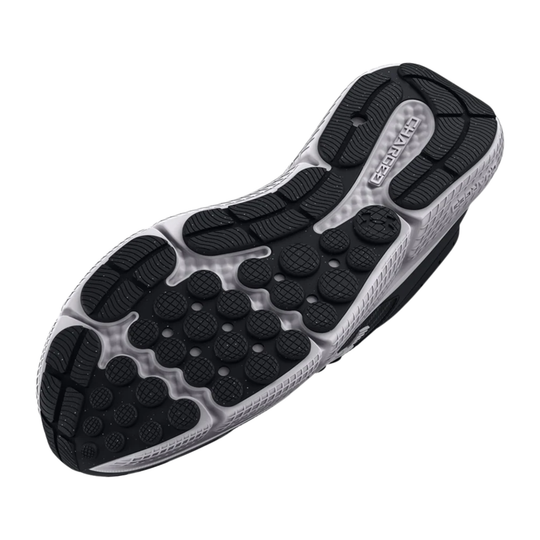The outsole of a running shoe, showing a black textured tread pattern over a silver and white cushioned midsole