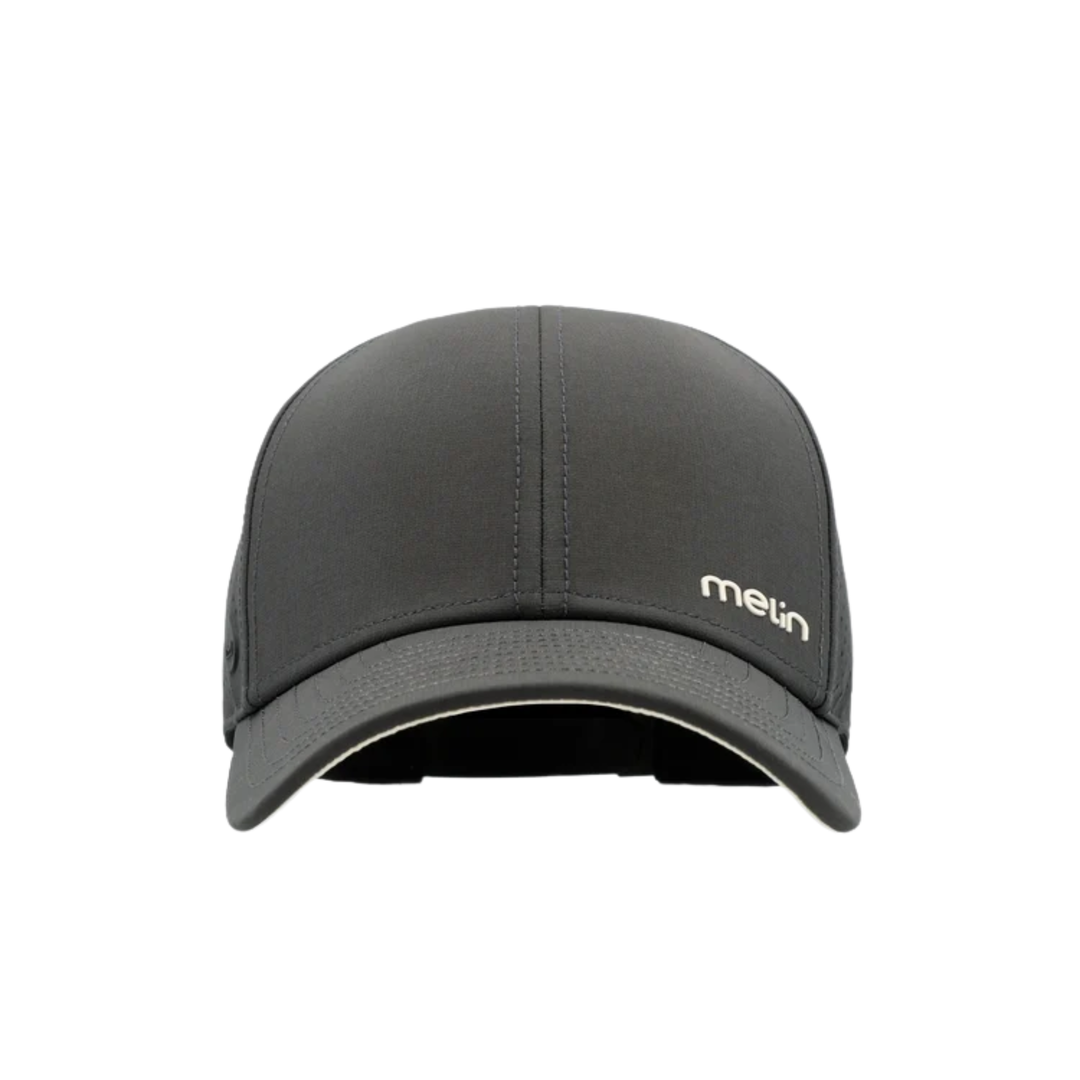 A dark gray performance baseball cap with a beige rectangular patch on the front displaying the 'melin' logo, shown against a plain white background.