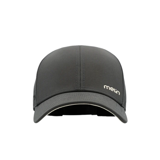 A dark gray performance baseball cap with a beige rectangular patch on the front displaying the 'melin' logo, shown against a plain white background.