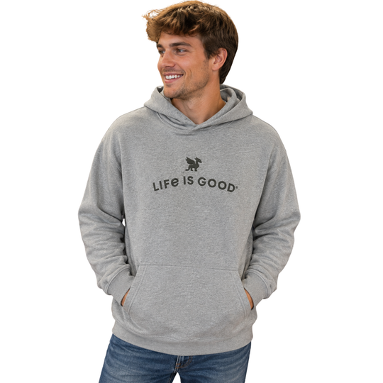 A man wearing a heather gray Life is Good pullover hoodie with the brand's logo printed on the chest, paired with blue jeans, set against a plain white background.