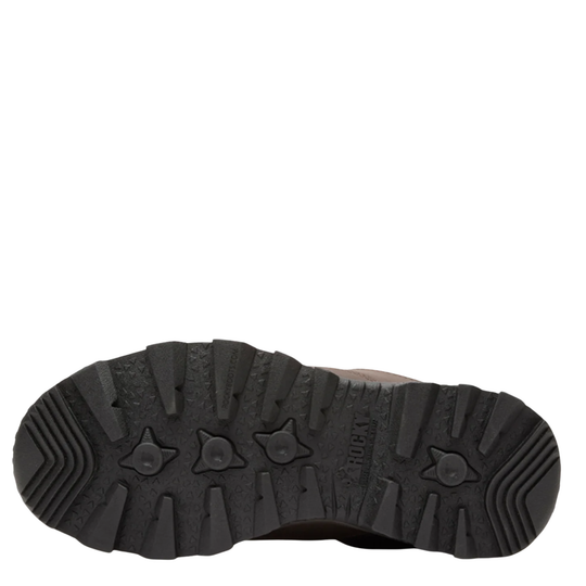 A close-up, top-down view of a black rugged shoe sole, showing deep lugs and tread patterns, with the brand name 'Rocky' embossed on the side.