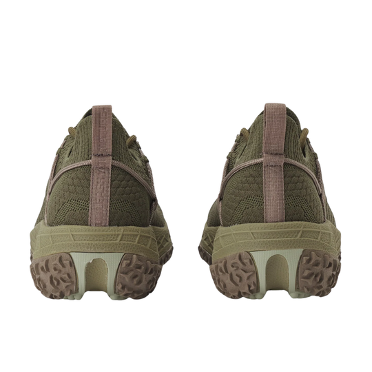 back heels of a pair of green athletic shoes on a white background