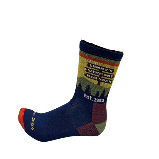 A single crew sock with a navy blue base, featuring a graphic design on the leg with the text 'LENNY'S VERMONT NEW YORK est. 1990' and a stylized forest silhouette.