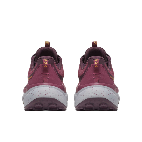 Pair of maroon sneakers with white soles on a white background