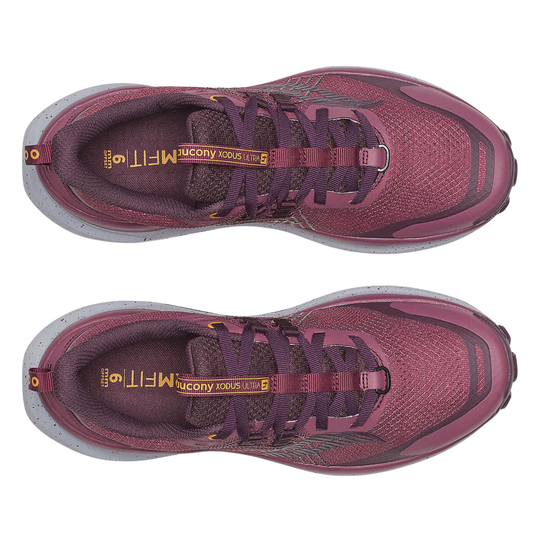 Pair of maroon running shoes with gray soles on a white background