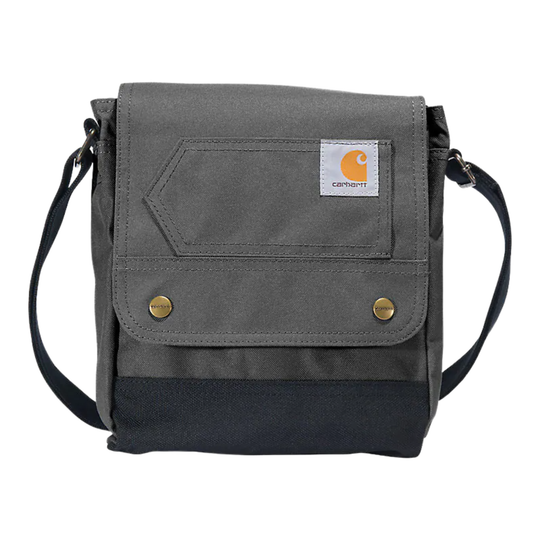 A gray and black Carhartt crossbody bag with a front flap pocket, brass snap buttons, and a white Carhartt logo patch, shown on a plain white background.