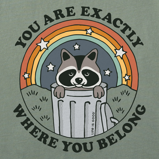 T-shirt with raccoon graphic and motivational text on a green background