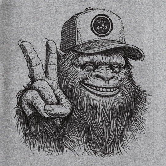Heather gray tee with a Sasquatch graphic wearing a cap and making a peace sign