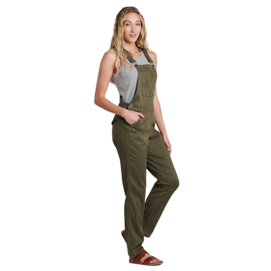 Woman wearing green overalls on a white background