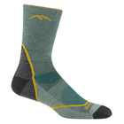Green sock with yellow accents on a white background