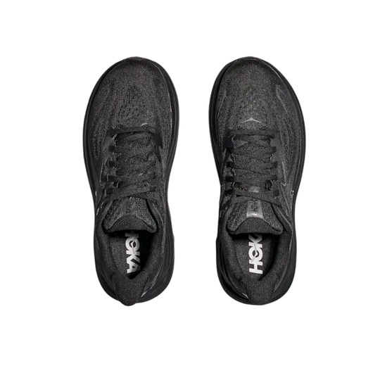 Pair of black running shoes with 'Hoka' branding on a white background