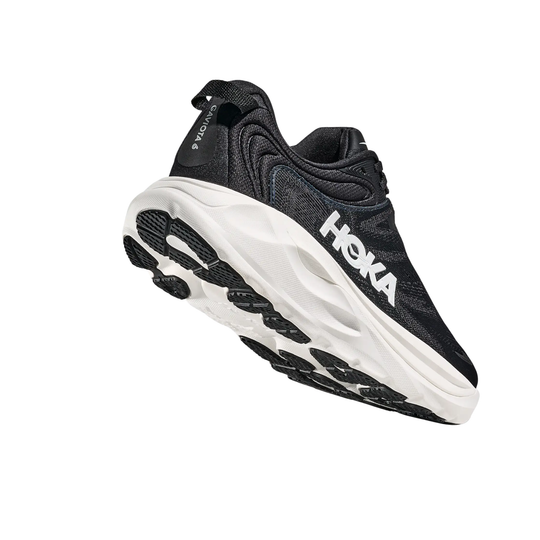 Black running shoe with white sole on a white background