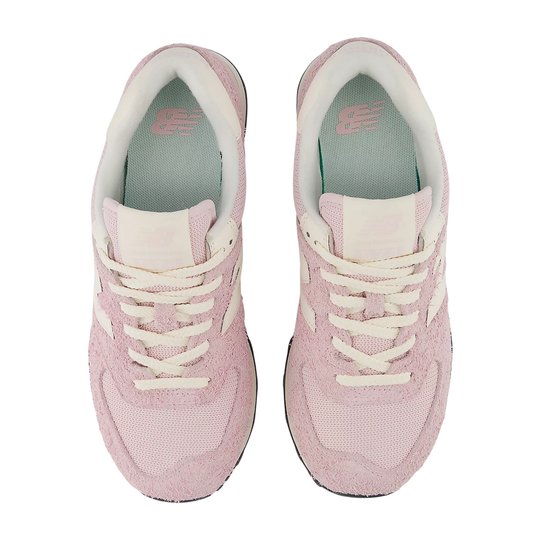 Pair of pink sneakers with white laces on a white background