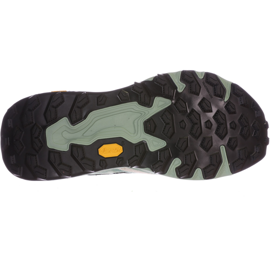 Close-up of a hiking shoe sole with a brand logo on a white background