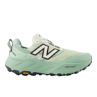 Green running shoe with New Balance logo on a white background