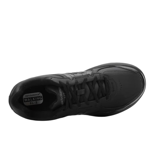 Black lace-up walking shoe with low-top profile and rounded toe, viewed from above
