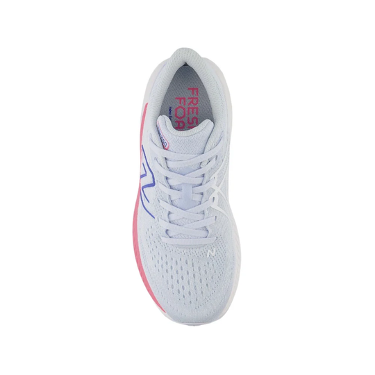 White running shoe with pink accents on a white background