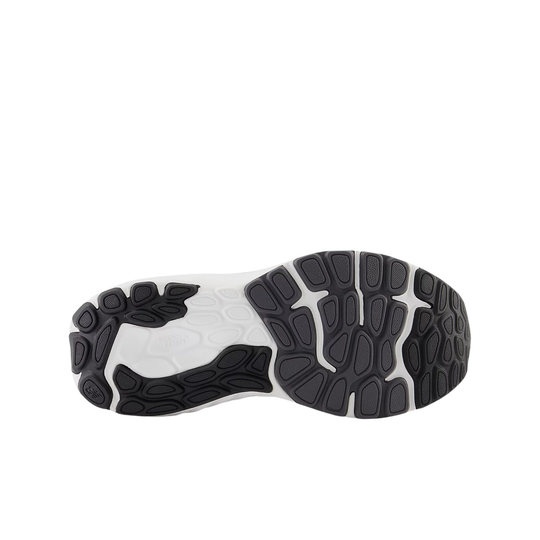 Close-up of a shoe sole with black and white tread pattern on a white background