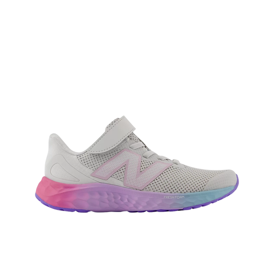White and pink sneaker with a colorful sole on a white background