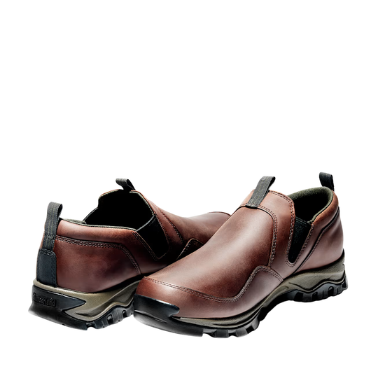 Pair of brown slip-on shoes on a white background