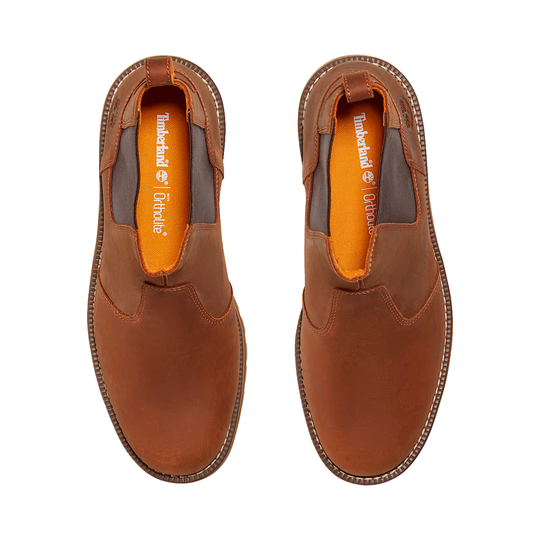 Pair of brown leather Chelsea boots with orange insoles, shown from above