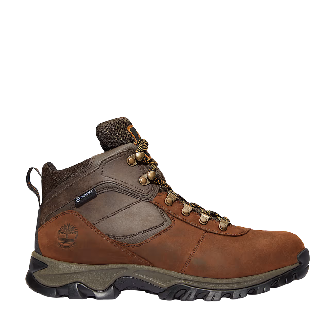 Brown and dark hiking boot with padded collar, metal eyelets, and lugged sole