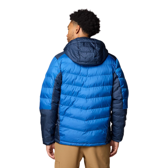 Person wearing a blue puffer jacket on a white background