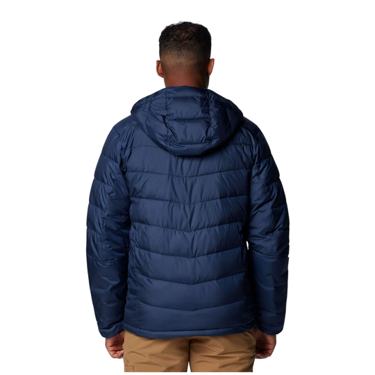 Person wearing a blue puffer jacket on a white background