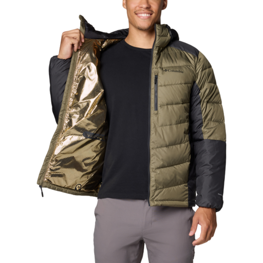 Person wearing a green and black jacket with a reflective inner lining on a white background