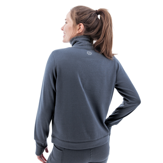 Woman wearing a gray jacket on a white background