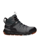 Gray and black hiking boot with brown sole on a white background