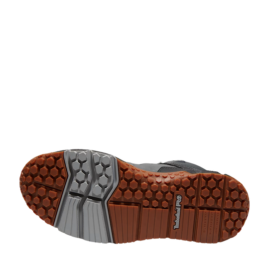 Close-up of a shoe sole with brown and gray tread pattern on a white background