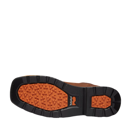 Close-up of a shoe sole with orange tread pattern on a white background