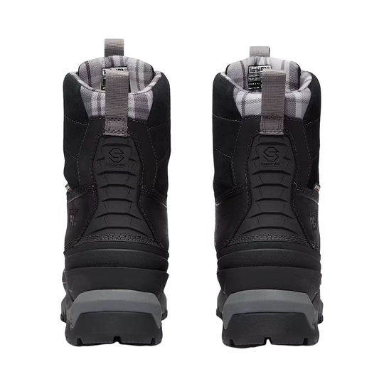 Black winter boots with gray soles on a white background