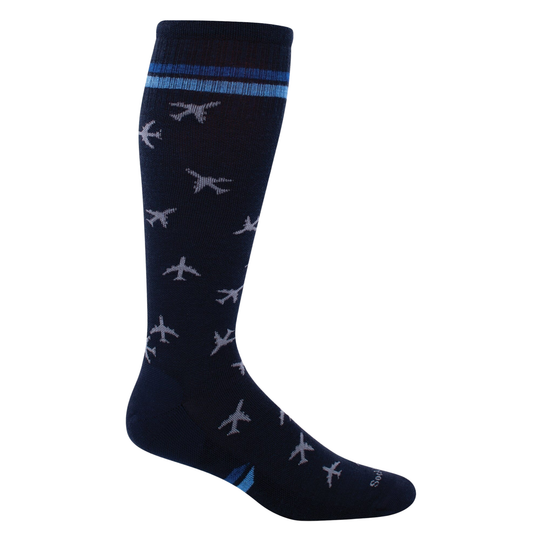 Navy knee-high sock with orange dot pattern on a white background