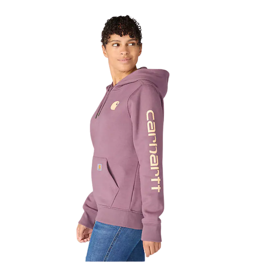 Mauve hooded sweatshirt with Carhartt logo on the chest and sleeve, worn with jeans