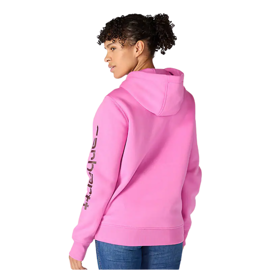 Person wearing a pink hoodie with text on the back, standing against a white background