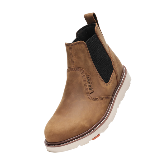 Brown Chelsea boot with white sole on a white background