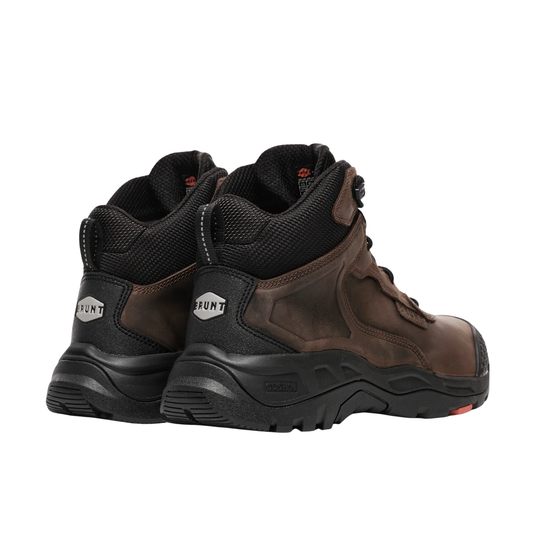 Pair of brown and black work boots on a white background